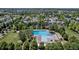 Stunning aerial view of the community pool surrounded by lush greenery and well-maintained homes at 2737 Ulster St, Denver, CO 80238