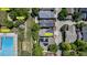 Aerial view showcasing a home with solar panels, a pool, park, and playground in a vibrant community at 2737 Ulster St, Denver, CO 80238