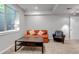 Finished basement with a cozy seating area, providing extra living space for relaxation and entertainment at 2737 Ulster St, Denver, CO 80238