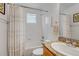 Clean bathroom with a shower-tub combo, granite vanity, and modern fixtures, offering a comfortable and stylish space at 2737 Ulster St, Denver, CO 80238