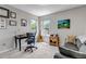Comfortable bedroom with two windows, neutral walls, and versatile decor, suitable for an office or guest room at 2737 Ulster St, Denver, CO 80238