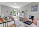 Inviting bedroom with bright sunlight, a cozy bed, a desk, and a comfy couch, creating a cheerful atmosphere at 2737 Ulster St, Denver, CO 80238