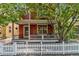 Beautiful two-story home with a welcoming front porch and classic white picket fence at 2737 Ulster St, Denver, CO 80238
