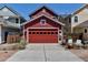 Detached two-car garage and outdoor living area with a fire pit and seating at 2737 Ulster St, Denver, CO 80238