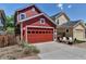 Detached two-car garage and outdoor living area with a fire pit and seating at 2737 Ulster St, Denver, CO 80238