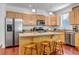 Efficient kitchen layout with modern appliances, island seating, and ample cabinet space at 2737 Ulster St, Denver, CO 80238