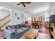 Comfortable living room seamlessly connects to the dining area and kitchen for easy living at 2737 Ulster St, Denver, CO 80238