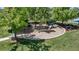 Charming community playground surrounded by mature trees and green lawn area at 2737 Ulster St, Denver, CO 80238