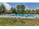 Community swimming pool surrounded by lush greenery and ample seating, creating an inviting outdoor oasis at 2737 Ulster St, Denver, CO 80238