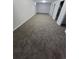 An expansive basement with neutral-toned carpet and multiple doorways, providing ample space for various uses at 5552 Abilene St, Denver, CO 80239