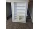 Basement has built-in bookshelf near stairs at 5552 Abilene St, Denver, CO 80239