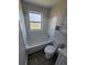 Cozy bathroom featuring a bathtub, window, and neutral tile walls at 5552 Abilene St, Denver, CO 80239