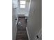 Bathroom featuring a white tiled shower-tub combination, window, vinyl floors, and white fixtures at 5552 Abilene St, Denver, CO 80239