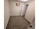 Bedroom featuring neutral carpet, white walls, and a standard closet at 5552 Abilene St, Denver, CO 80239