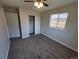 This bedroom features neutral paint, carpet, closet and a window at 5552 Abilene St, Denver, CO 80239