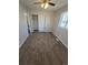 Bedroom with closet and window, featuring neutral walls and carpet at 5552 Abilene St, Denver, CO 80239
