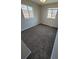 Cozy bedroom with neutral walls, carpet, and two windows providing natural light at 5552 Abilene St, Denver, CO 80239