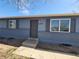 Close up of the front entrance, displaying the address and updated windows at 5552 Abilene St, Denver, CO 80239