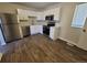 Bright kitchen featuring white cabinets, stainless steel appliances, and modern countertops at 5552 Abilene St, Denver, CO 80239
