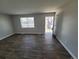 Bright, airy living room with wood flooring and a view of the outdoors at 5552 Abilene St, Denver, CO 80239