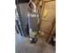 Rheem natural gas water heater installation featuring a newer model, with yellow gas lines at 5552 Abilene St, Denver, CO 80239