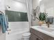 Bathroom featuring a shower and bathtub combination, designer fixtures and vanity at 1787 W 166Th Ave, Broomfield, CO 80023