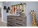 Bedroom decor featuring a gray dresser, safari animals and creative design at 1787 W 166Th Ave, Broomfield, CO 80023