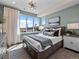 Stylish bedroom featuring a large window, modern decor, and plush bedding at 1787 W 166Th Ave, Broomfield, CO 80023