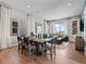 Open-concept dining and living area with hardwood floors and abundant natural light at 1787 W 166Th Ave, Broomfield, CO 80023