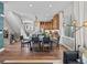 Open-concept dining area features a rustic wood table and seating for six, perfect for entertaining at 1787 W 166Th Ave, Broomfield, CO 80023