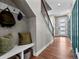 Inviting foyer with hardwood floors, storage nook, and modern front door at 1787 W 166Th Ave, Broomfield, CO 80023