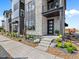 Inviting front entrance with stone accents and professional landscaping details at 1787 W 166Th Ave, Broomfield, CO 80023