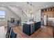 Beautiful open kitchen with large island, stainless steel appliances, and hardwood floors at 1787 W 166Th Ave, Broomfield, CO 80023