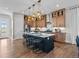 Modern kitchen features an island with bar seating, stainless steel appliances, and sleek countertops at 1787 W 166Th Ave, Broomfield, CO 80023