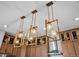 Modern kitchen lighting with stylish pendant lights over the island, enhancing the space's ambiance at 1787 W 166Th Ave, Broomfield, CO 80023