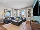 Spacious living room with plush seating, stylish decor, and a large window with scenic views at 1787 W 166Th Ave, Broomfield, CO 80023
