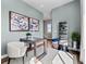 Bright office with modern desk, contemporary art, and a large plant at 1787 W 166Th Ave, Broomfield, CO 80023