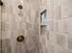 Close-up of shower featuring a bronze shower head and modern tile at 1787 W 166Th Ave, Broomfield, CO 80023