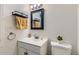 Cozy bathroom with white vanity, modern fixtures, and decorative accents at 9943 Croke Dr, Denver, CO 80260