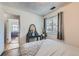 Comfortable bedroom with neutral walls, a window for natural light, and vinyl wood flooring at 9943 Croke Dr, Denver, CO 80260