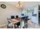 Comfortable dining area adjacent to the kitchen, featuring a classic dining table at 9943 Croke Dr, Denver, CO 80260