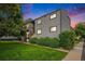 Well-maintained apartment building featuring manicured lawns and mature trees at 16259 W 10Th Ave # K-3, Golden, CO 80401