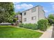 Well-maintained apartment building featuring manicured lawns and mature trees at 16259 W 10Th Ave # K-3, Golden, CO 80401