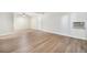 A spacious living room with hardwood flooring and a window air conditioning unit at 16259 W 10Th Ave # K-3, Golden, CO 80401