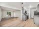 Open-concept living room next to kitchen and has a sliding glass door leading to a balcony at 16259 W 10Th Ave # K-3, Golden, CO 80401