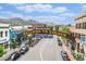 Charming street view with the 'Welcome to Golden' sign, showcasing nearby shops, cars, and the beautiful mountain backdrop at 16259 W 10Th Ave # K-3, Golden, CO 80401