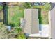 This aerial view reveals a well-maintained property with a large yard and ample parking at 8353 Adams Way, Denver, CO 80221