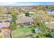 This aerial view shows a house with a patio and backyard at 8353 Adams Way, Denver, CO 80221
