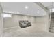Finished basement featuring neutral carpet, recessed lighting, and stairs at 8353 Adams Way, Denver, CO 80221