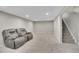 Finished basement offering neutral carpet, recessed lighting, and stairs to upper level at 8353 Adams Way, Denver, CO 80221